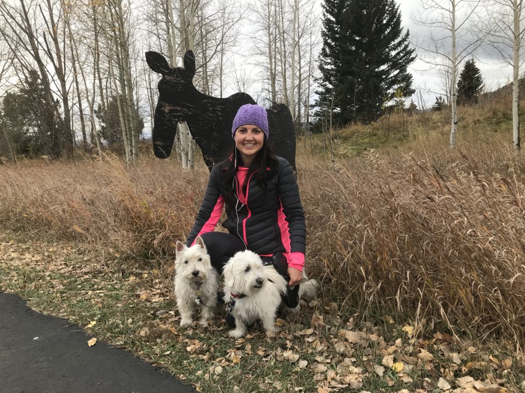 Julie K and white dogs with Moose sign after 40th birthday run