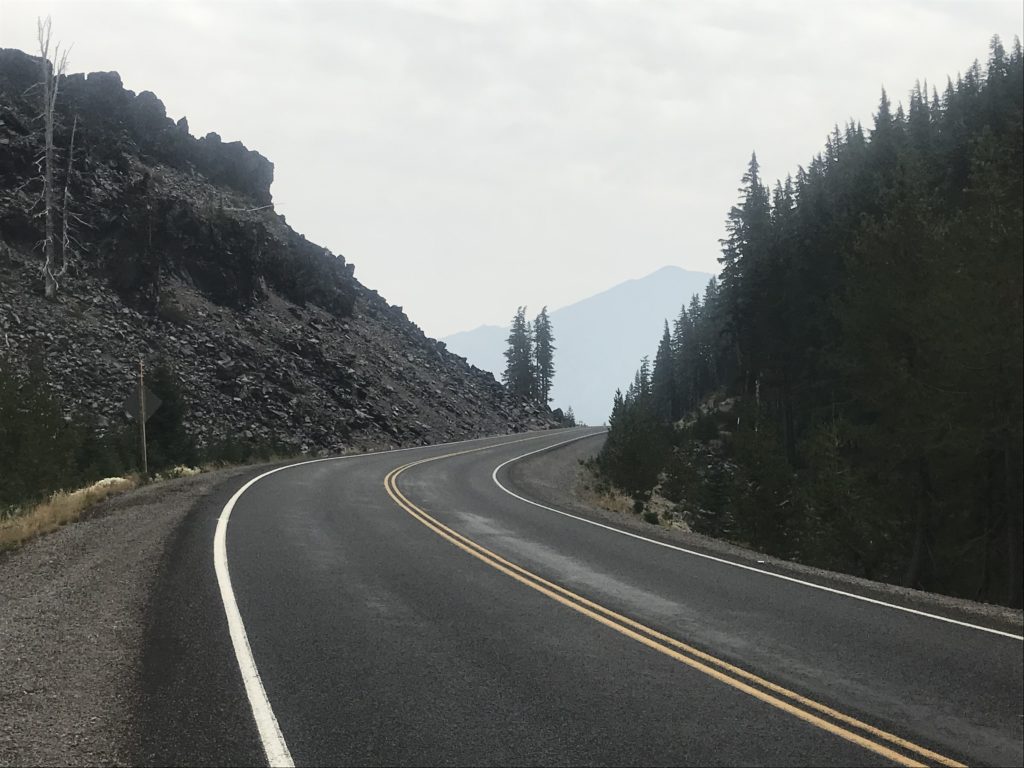 curvy road with double yellow line along cinder cones
