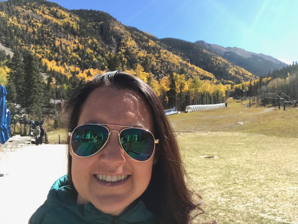 Julie K. with gold aspens in Taos Ski Valley