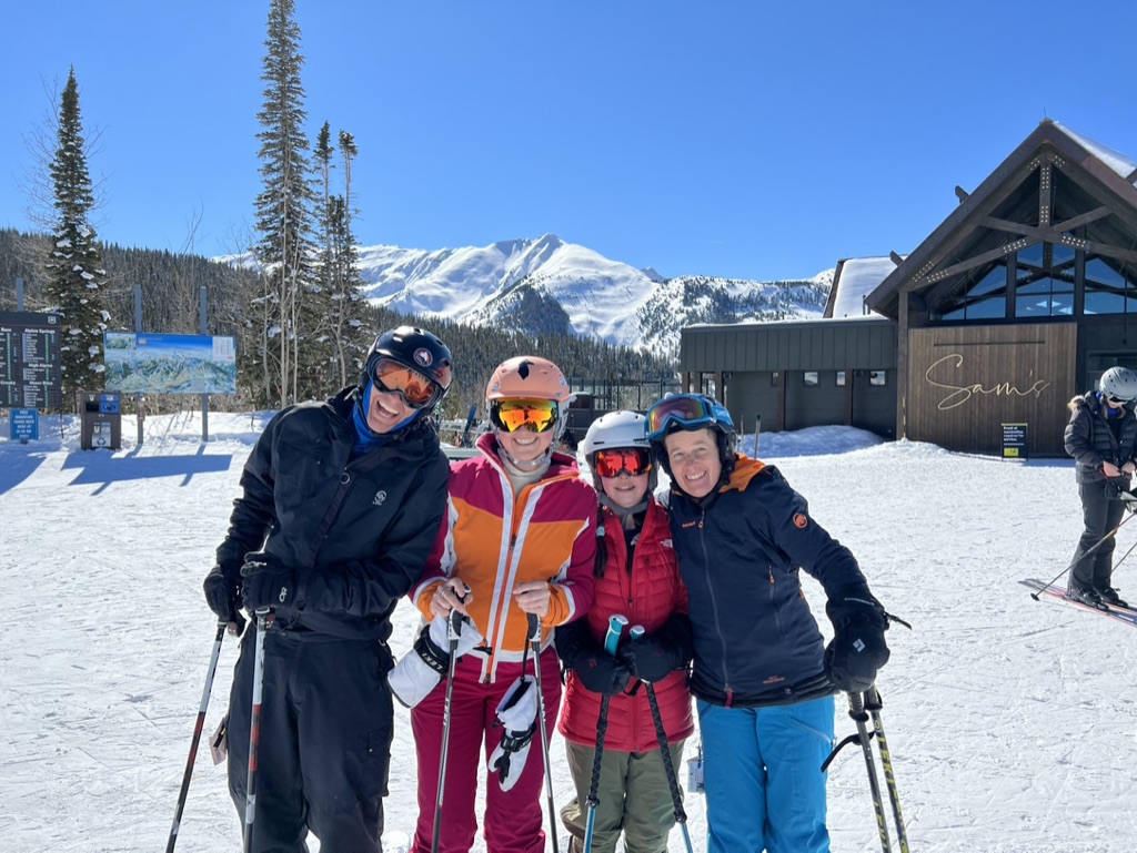Julie K skiing with friends at Snowmass