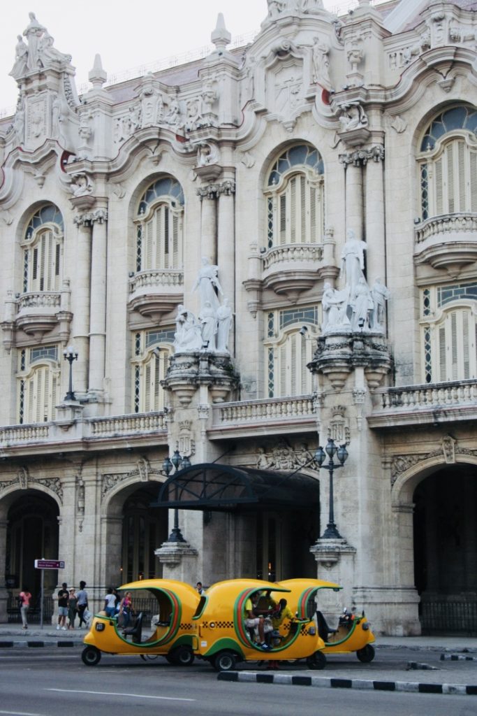 Yellow 3 wheeled taxi in Havana