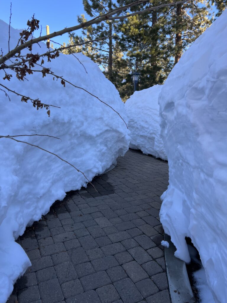 tiny path with walls of snow on either side