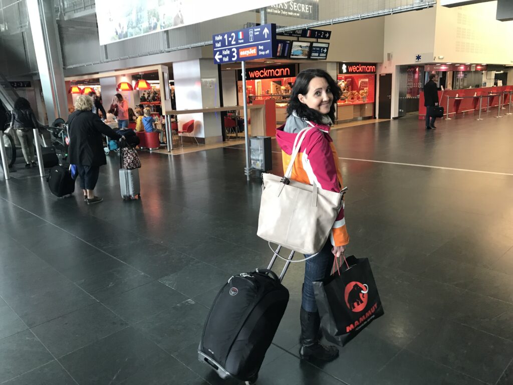 Julie K in airport with luggage