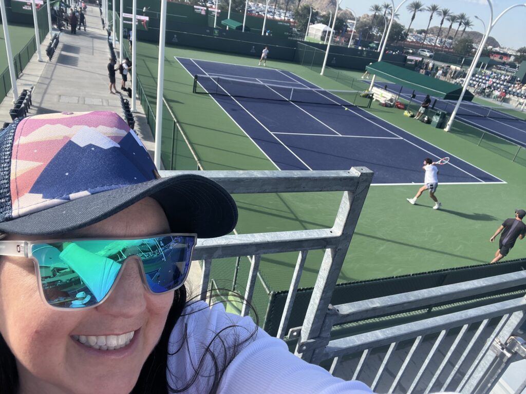 Julie K overlooking practice courts at Indian Wells Tennis Garden