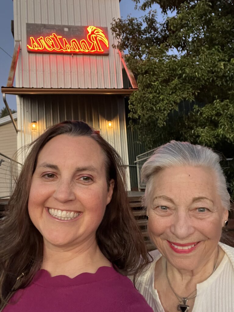 Investing in friends--Julie K and K in front of Roosters