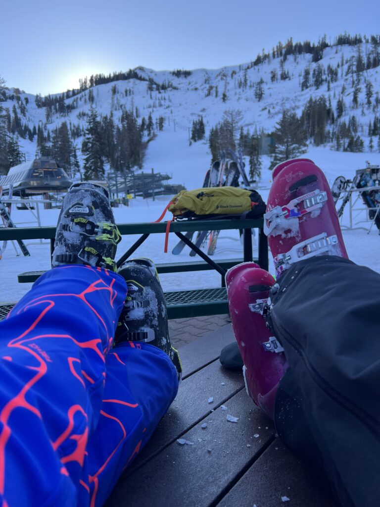 Julie K and G2 kicking up their ski boots at sunset