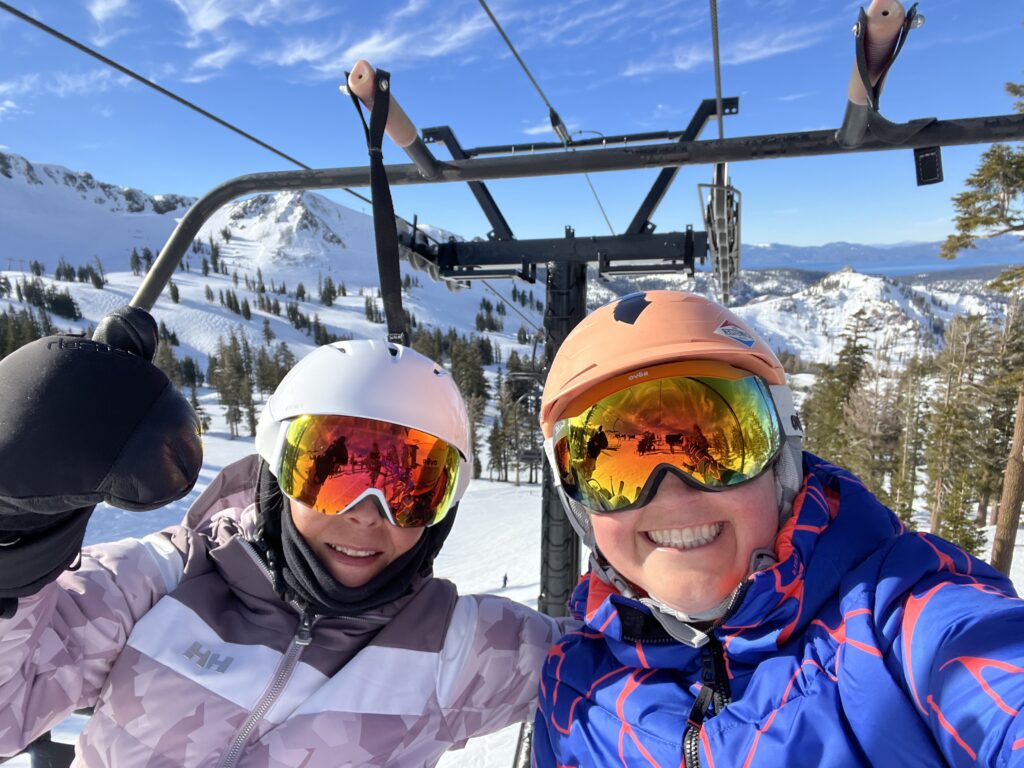 Julie K and her new gal friend riding the chairlift